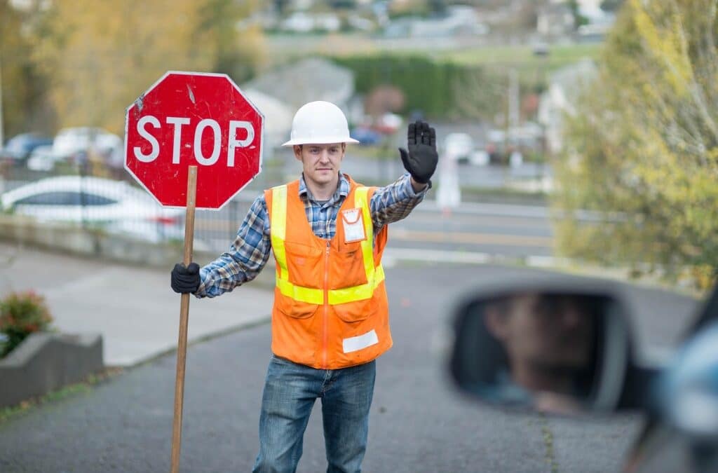 construction-worker-holding-stop-sign